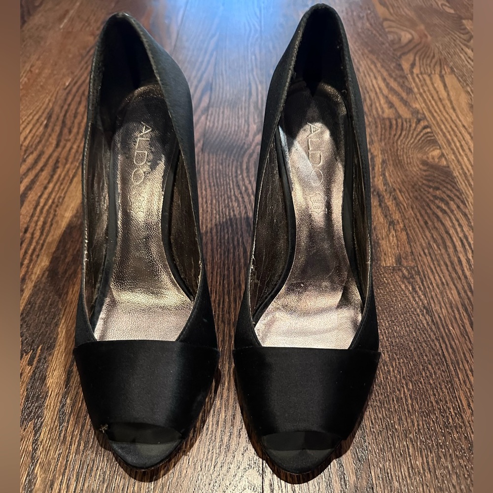Black satin peep toe pumps